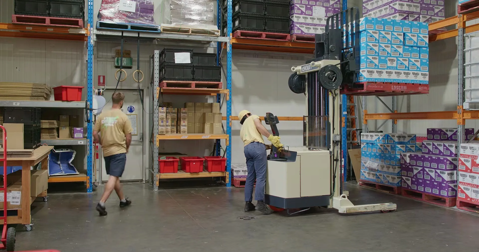 Barbell Foods stock and forklift in their warehouse